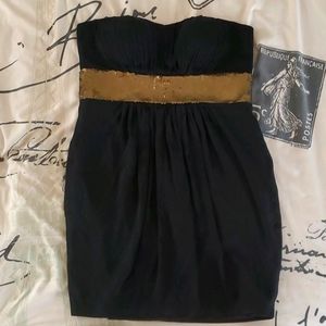 Black strapless dress with gold sequence belt